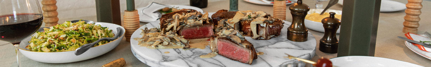 sliced wagyu steaks on a holiday dinner table