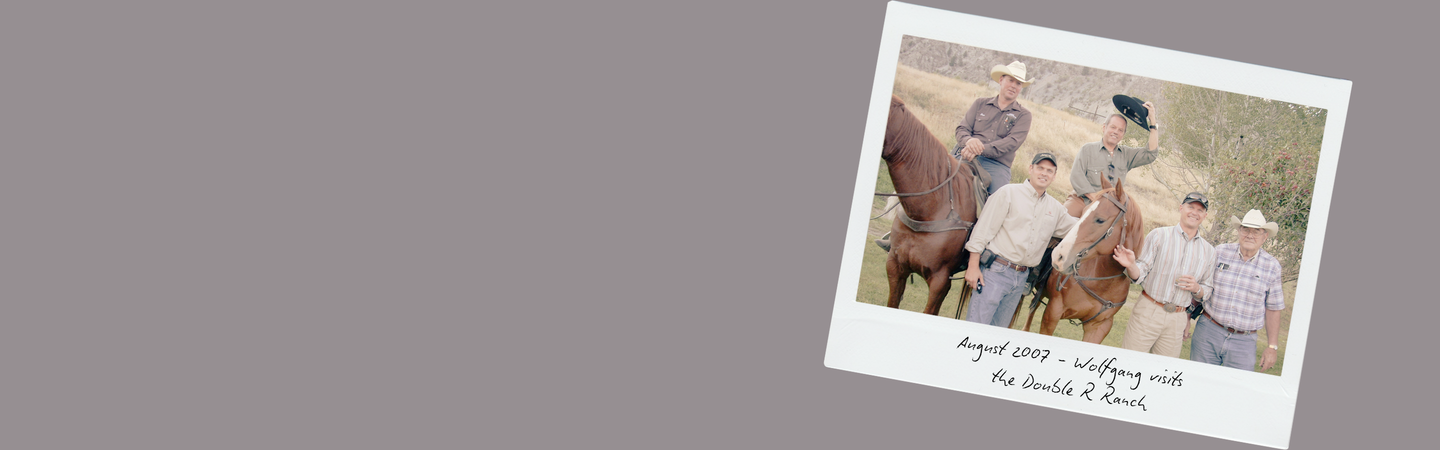 polaroid image of Chef Wolfgang Puck on a horse at the Double R Ranch with Robert Rebholtz and others.