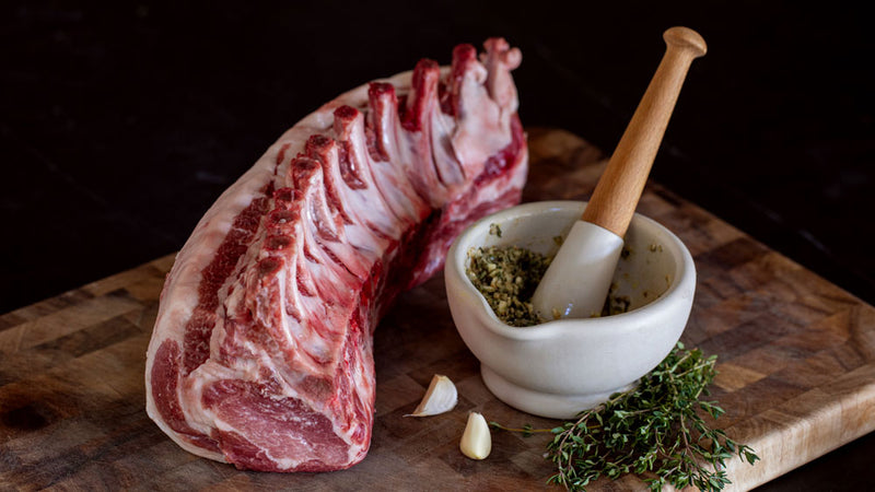 Kurobuta Rack of Pork on cutting board