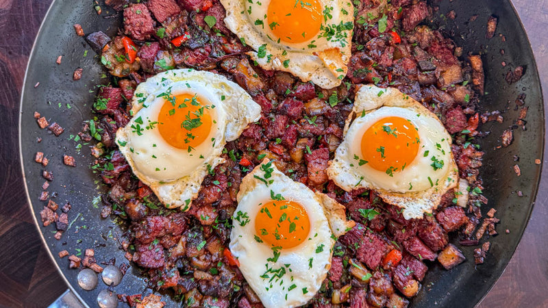 Wagyu Corned Beef Hash with Eggs in pan 