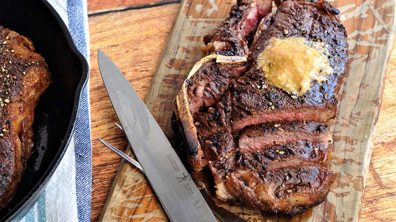 Black Pepper-Crusted Bone-In NY Strip with Smoked Bleu Cheese Butter