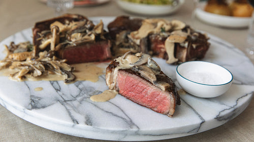 Bone-In NY Strip with Wild Mushroom Cream Steak Sauce