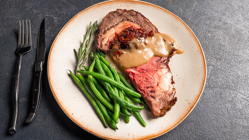 Bone-In Prime Rib with Shallot-Red Wine Jam & Black Pepper Gravy