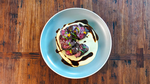 American Wagyu Black® Hanger Steak with Onion Soubise and Tamarind Reduction