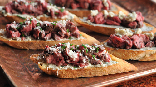 Rolled Cap of Ribeye Crostini – Two Ways