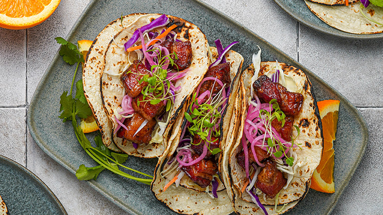 Crispy Smoked Kurobuta Pork Belly Tacos with Serrano-Orange Glaze 