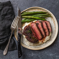 cooked and sliced top sirloin plated 