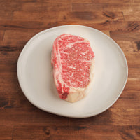 Dry-aged bone-in NY strip steak 