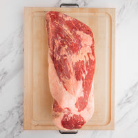 USDA Choice brisket in cutting board 