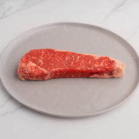 USDA Choice NY strip steak on plate 