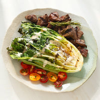 USDA Choice Steak Cuts with romaine salad and tomatoes 