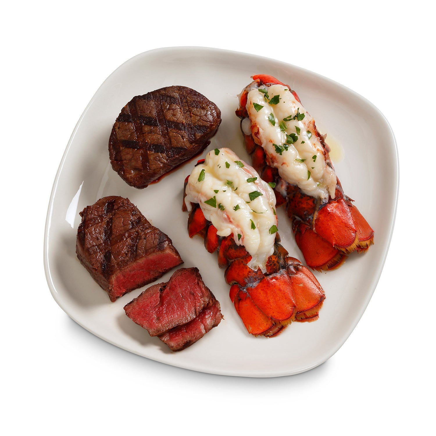 Cooked lobster and steak on a plate on white background 
