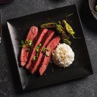 Flank Steak cooked and sliced with rice and peppers