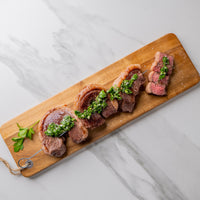 Cooked USDA Picanha on skewer with chimichurri 