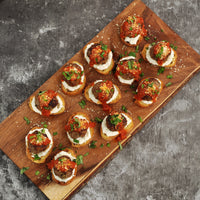 Cooked ground beef meatballs dish on cutting board 