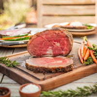 sliced and cooked prime rib on cutting board 