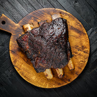 cooked short plate ribs on cutting board 