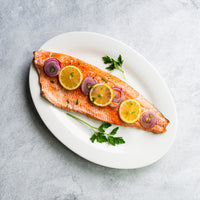 Plated Alaskan Coho Salmon Filet with Lemon 