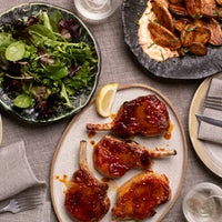 Kurobuta Glazed Pork Chop plated with side dishes 