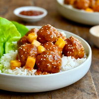 Cooked ground pork meat balls on rice 