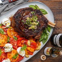 Cowboy steak cooked plated with burrata salad