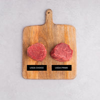 USDA Choice and Prime comparison on cutting board 