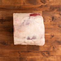 Bone in Prime Rib on wood background 