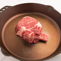 Small Bone-In Ribeye Steak in pan 