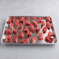 USDA Prime dry-aged steak cuts raw on sheet pan 