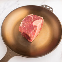 Bone-In Filet Mignon 2" USDA Prime raw steak in pan 