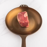 Raw 2" Bone-In Filet Mignon in Cast Iron Skillet 