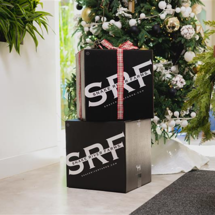 two Snake River Farms Boxes in front of a Christmas Tree