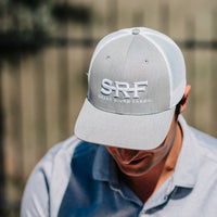 Guy wearing a SRF Trucker Hat 