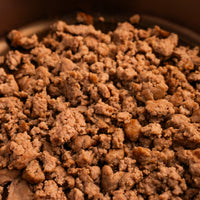 Cooked and crumbled ground pork 