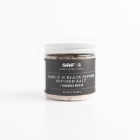 Jar of Garlic & Black Pepper Infused Salt by SRF on a white background