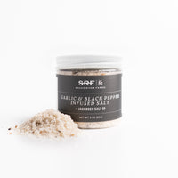 Jar of Garlic & Black Pepper Infused Salt with SRF branding on a white background