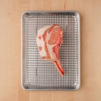 Pork chop on rack and sheet pan 