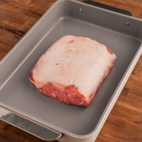 Raw pork loin roast in pan 