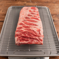 Kurobuta Pork Spare Ribs raw on rack 