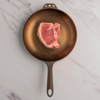 Pork Porterhouse in cast iron skillet 