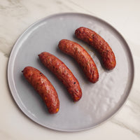 cooked sausages on plate 