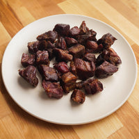 Smoked Pork Burnt Ends on white plate 