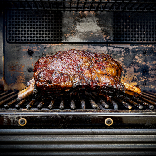 Smoked Bone-In plate short Ribs on grill 