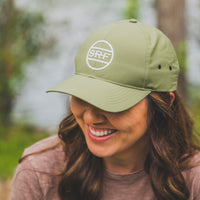 woman wearing SRF green athletic hat 