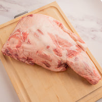 raw pork shoulder on cutting board 