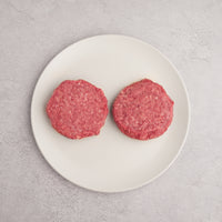 USDA Prime Hamburger Patties on a white plate 