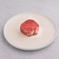 USDA Prime filet mignon on white plate 