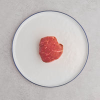 USDA Prime Top Sirloin Steak on white plate 