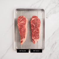 SRF Black and Gold steak comparison on rack with pan 