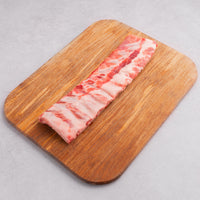 Raw Baby Back Ribs on cutting board 